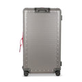 Suitcase - TRUNK ON WHEELS L Aluminum Steel Grey With Red Leather Handles