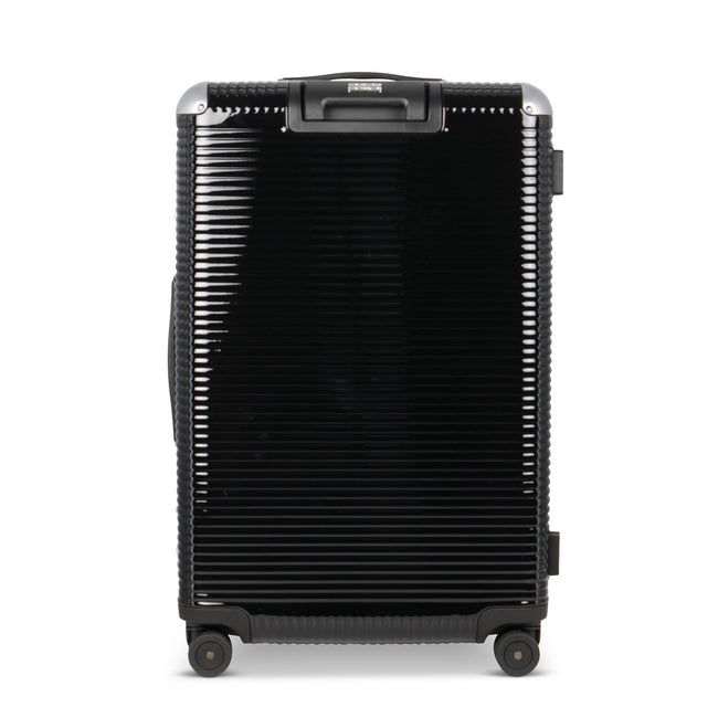 Suitcase - TRUNK ON WHEELS Light Polycarbonate Licorice Black With Black Leather Handles 